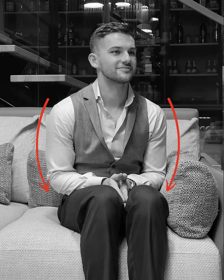 Closed, low-status body language